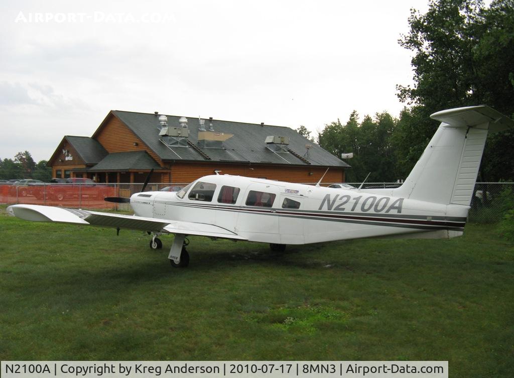 N2100A, 1978 Piper PA-32RT-300T Turbo Lance II C/N 32R-7987002, Piper PA-32RT-300T Lance sitting in the rain at Breezy Point, MN.