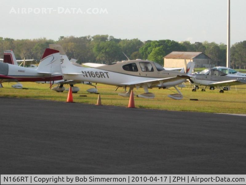 N166RT, 2007 Cirrus SR22 G3 GTS Turbo C/N 2687, Tied down in the grass at Zephyrhills, Florida