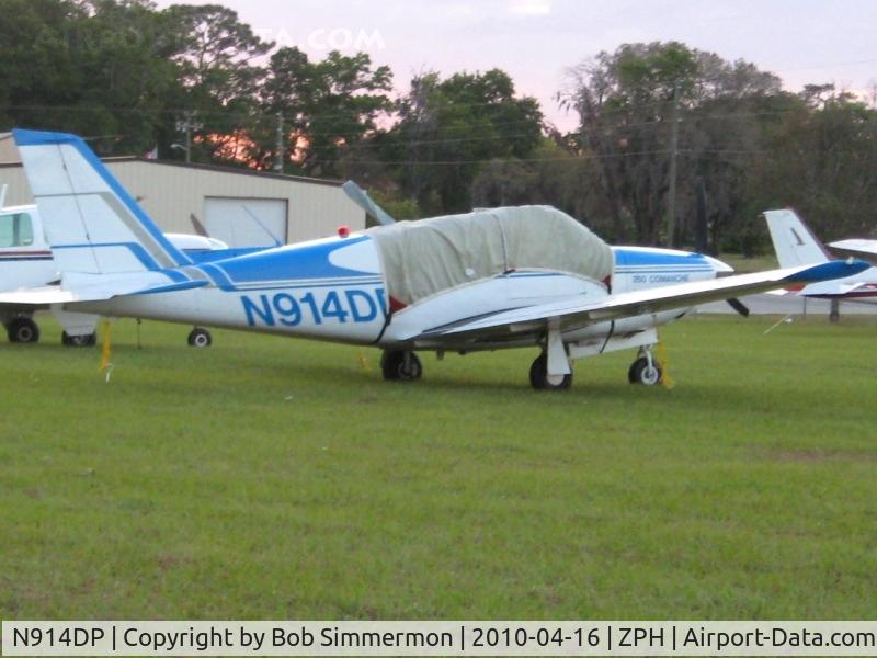 N914DP, 1966 Piper PA-24-260 C/N 24-4633, Tied down in the grass at Zephyrhills, Florida