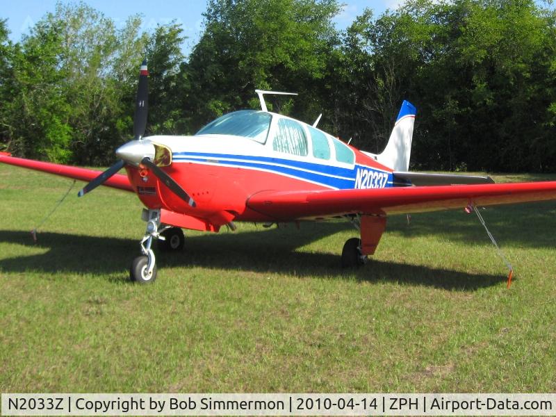 N2033Z, 1978 Beech F33A Bonanza C/N CE-810, Tied down in the grass at Zephyrhills, Florida