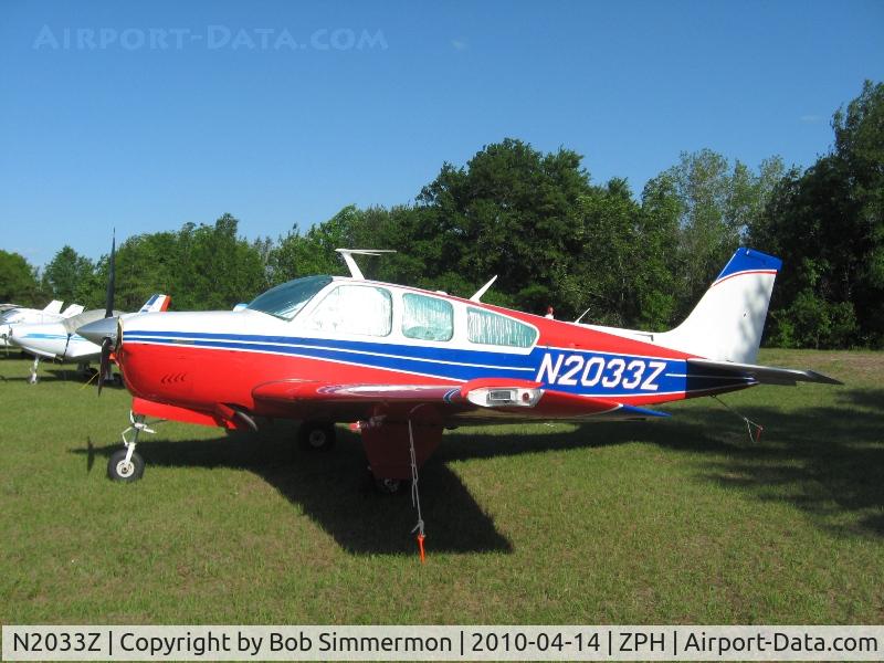 N2033Z, 1978 Beech F33A Bonanza C/N CE-810, Tied down in the grass at Zephyrhills, Florida