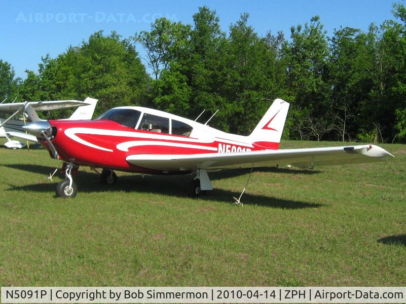 N5091P, 1958 Piper PA-24 C/N 24-100, In the grass at Zephyrhills, Florida