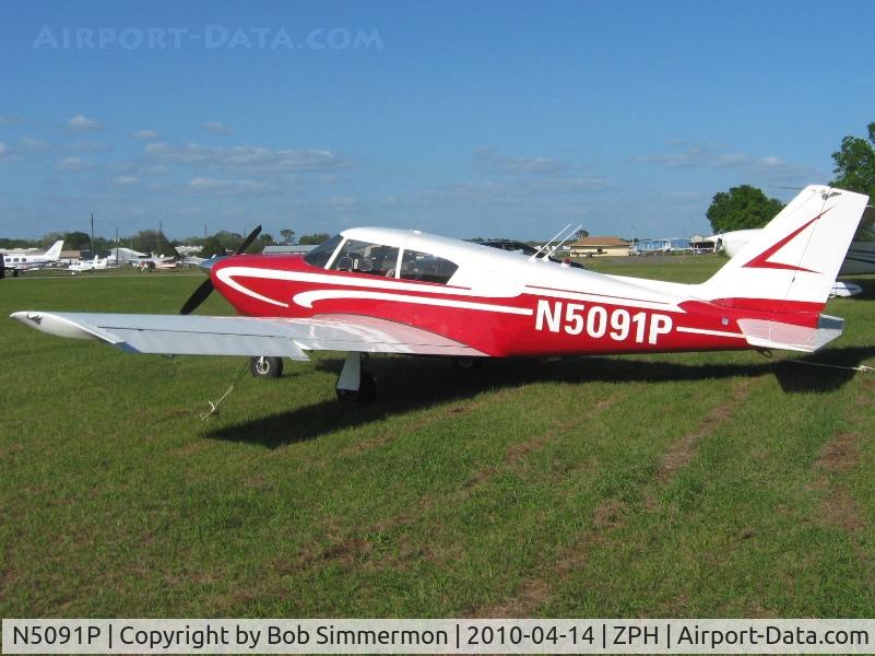 N5091P, 1958 Piper PA-24 C/N 24-100, In the grass at Zephyrhills, Florida