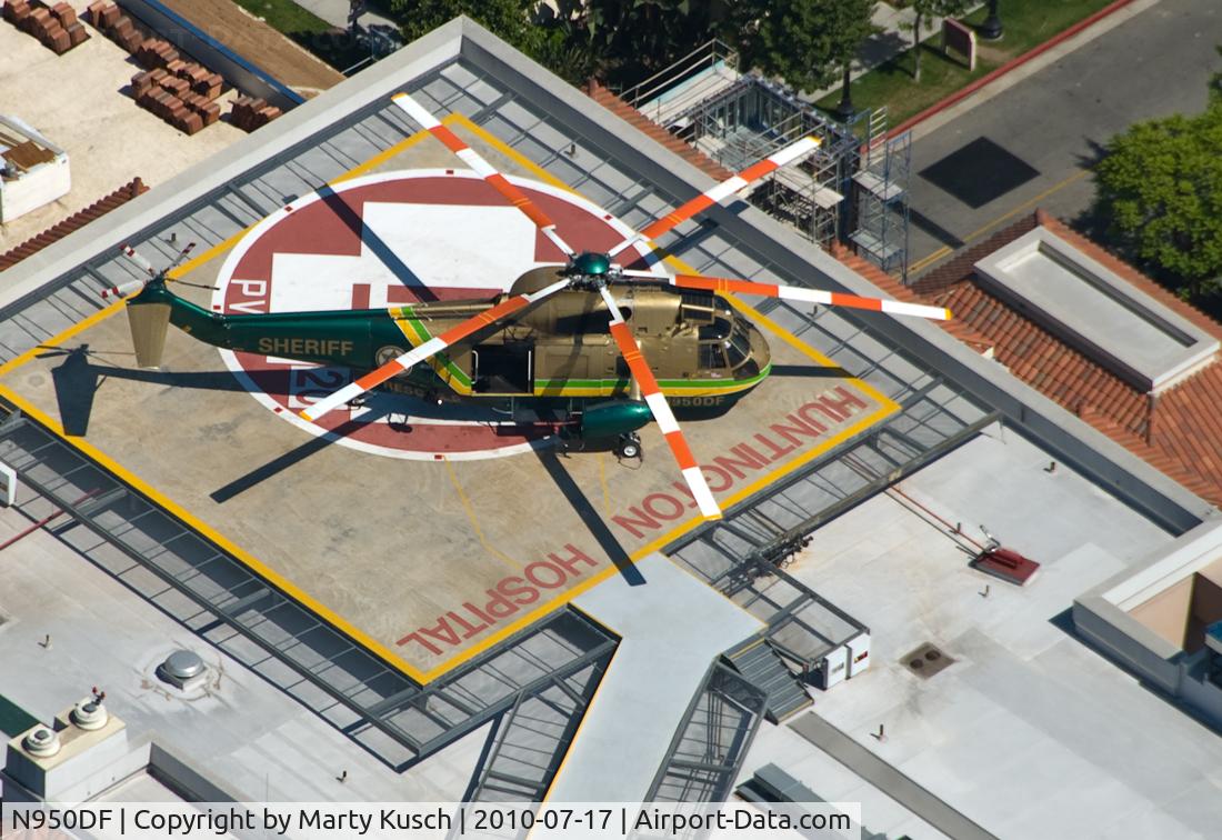 N950DF, Sikorsky SH-3H C/N 152702, Parked on pad at Huntington Memorial Hospital in Pasadena.