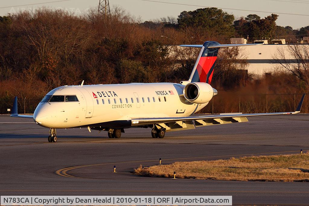 N783CA, Bombardier CRJ-100ER (CL-600-2B19) C/N 7315, Delta Connection (Comair) N783CA (FLT COM6624) exiting RWY 5 at Taxiway Echo late in the day after arrival from John F Kennedy Int'l (KJFK).