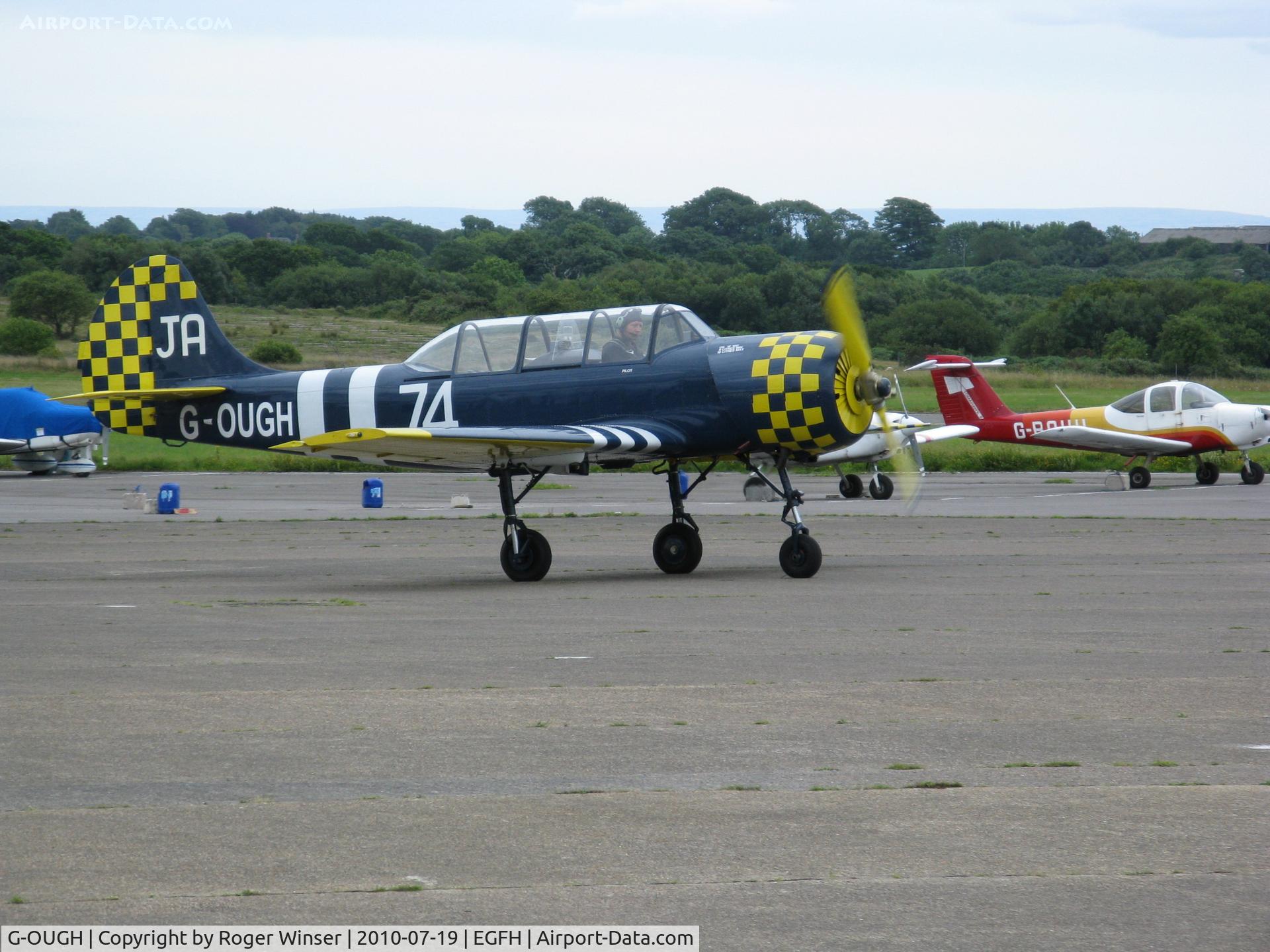 G-OUGH, 1987 Bacau Yak-52 C/N 877404, Previously registered G-LAOK. Based at Swansea Airport. Marked 62/IV on port side 