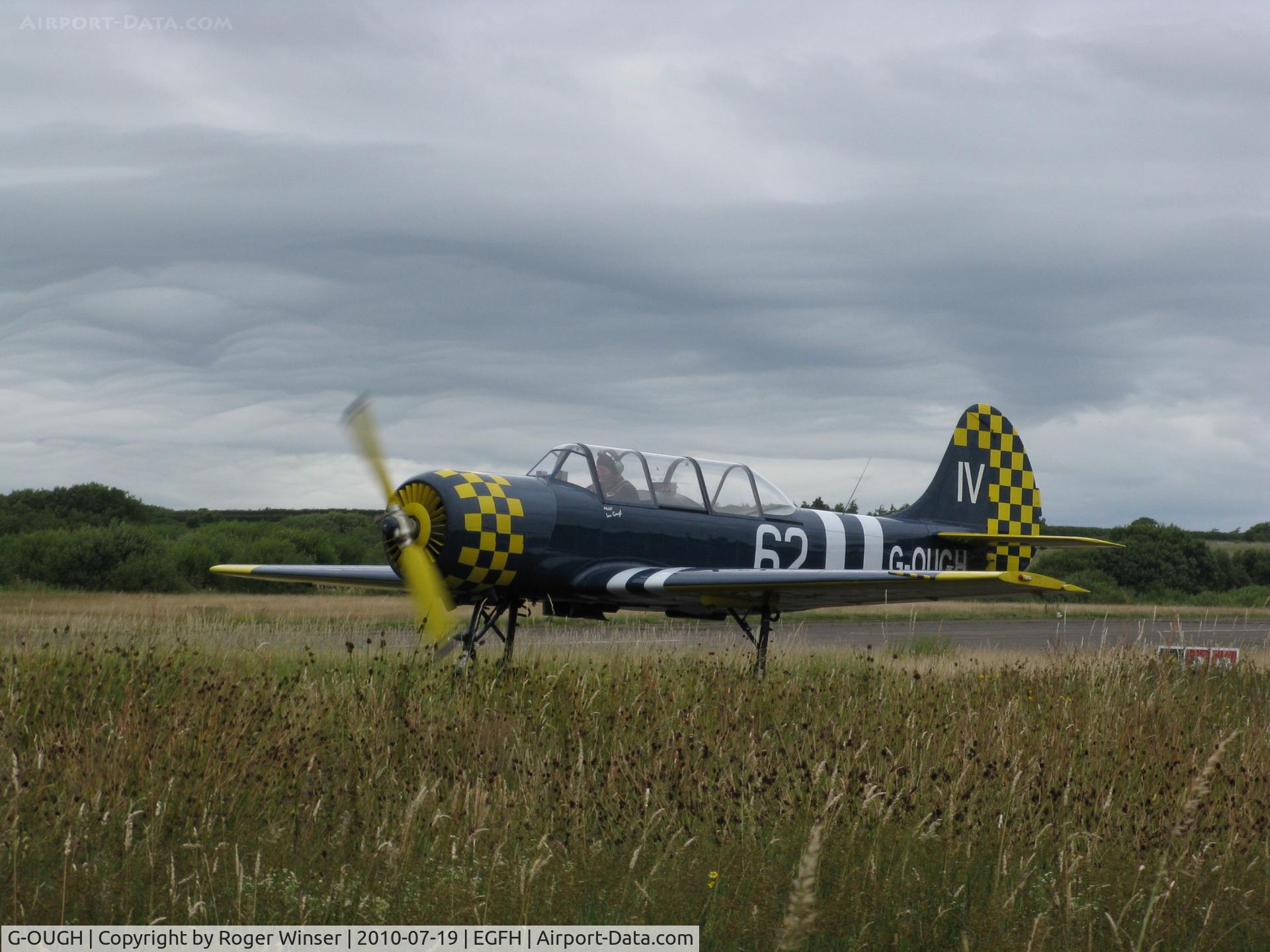 G-OUGH, 1987 Bacau Yak-52 C/N 877404, Previously registered G-LAOK. Based at Swansea Airport. Marked 74/JA on starboard side 