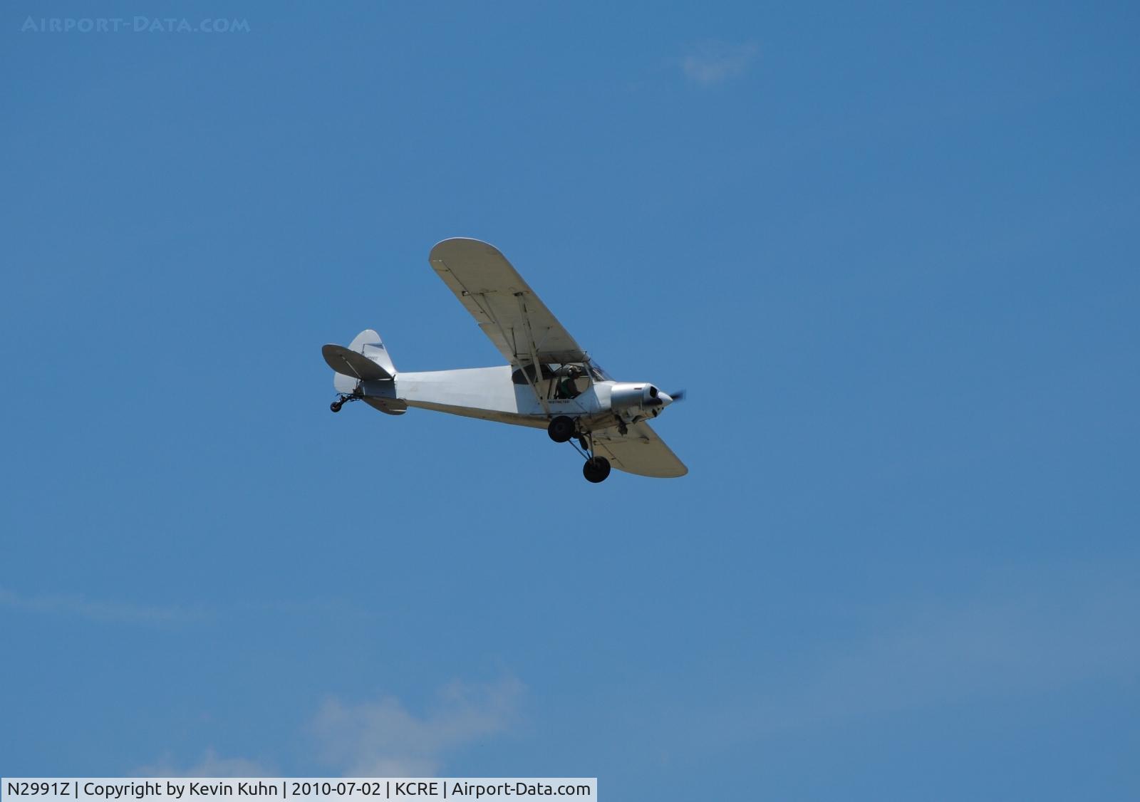 N2991Z, 1959 Piper PA-18-150 Super Cub C/N 18-7109, Swooping in to pick up another banner