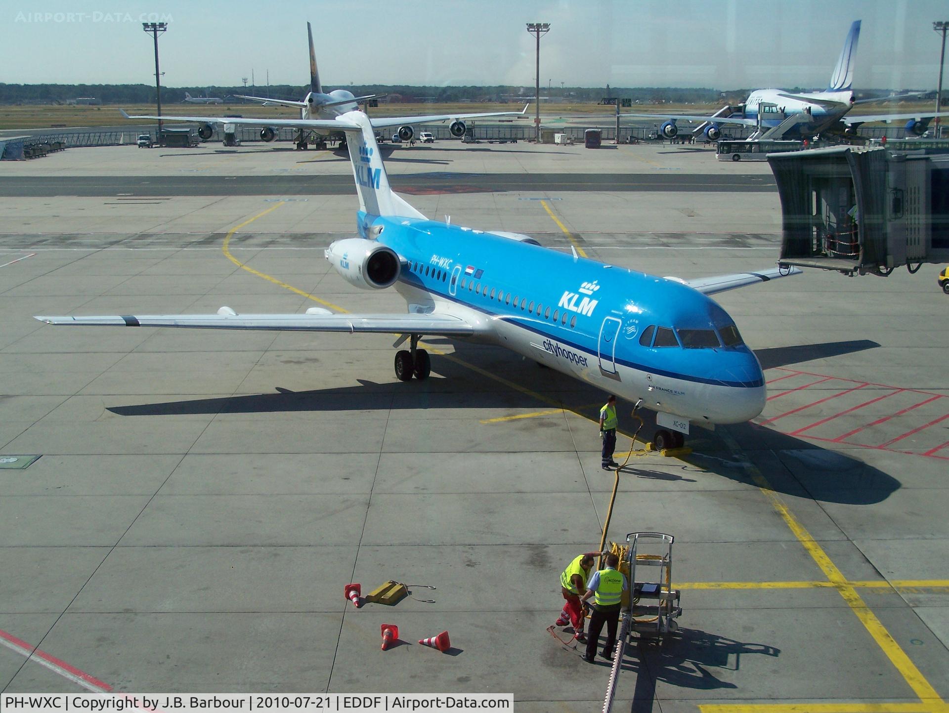 PH-WXC, 1996 Fokker 70 (F-28-0070) C/N 11574, Our wings to Amsterdam.  The Fokker was a nice ride.  A little tight but nice.  However it was noisy on landing than most A/C I have been in before.