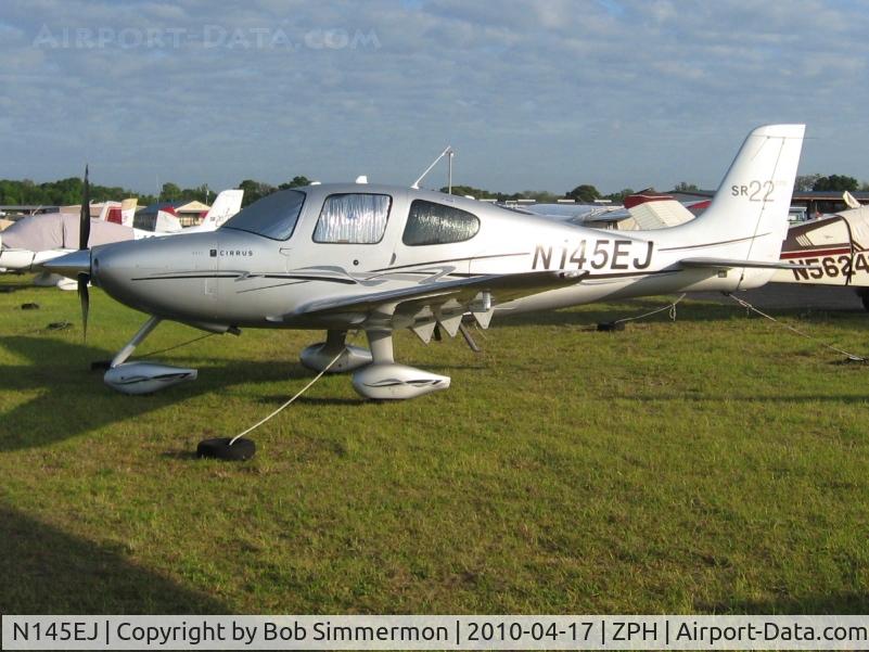 N145EJ, Cirrus SR22 GTS C/N 3383, Tied down in the grass at Zephyrhills, Florida during Sun N Fun week.