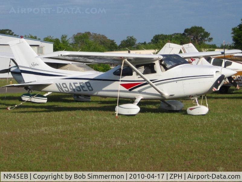 N945EB, 1998 Cessna 182S Skylane C/N 18280137, Tied down in the grass at Zephyrhills, Florida during Sun N Fun week.