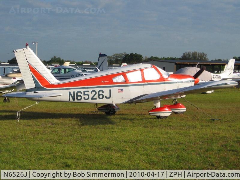 N6526J, 1968 Piper PA-28-180 C/N 28-4964, Tied down in the grass at Zephyrhills, Florida during Sun N Fun week.
