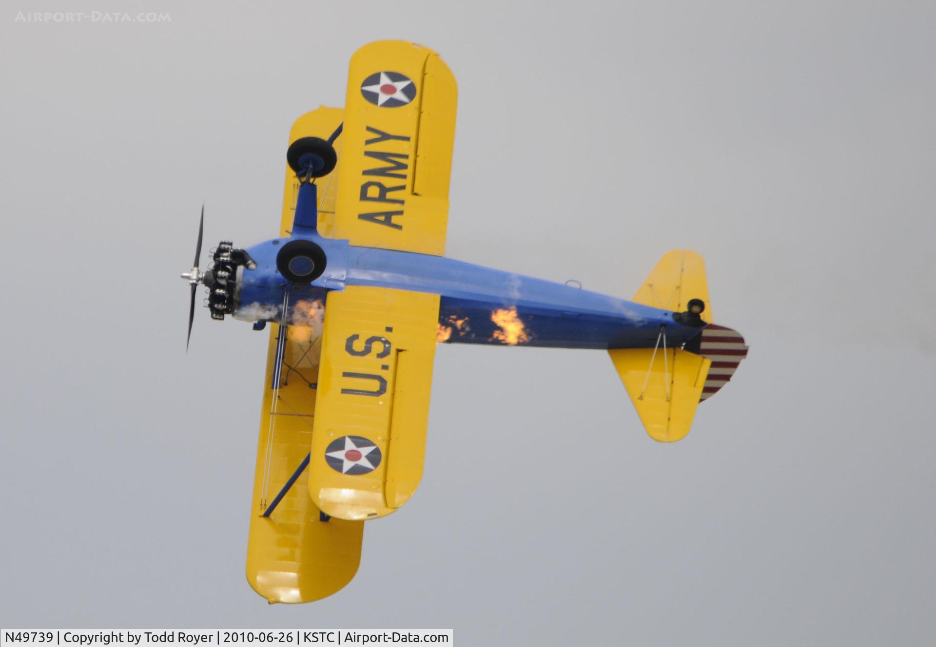N49739, 1943 Boeing A75N1(PT17) C/N 75-4462, PERFORMING AT GREAT MINNESOTA AIR SHOW, NOTE THE RAW FUEL BURNING ALONG THE SIDE OF THE AIRCRAFT