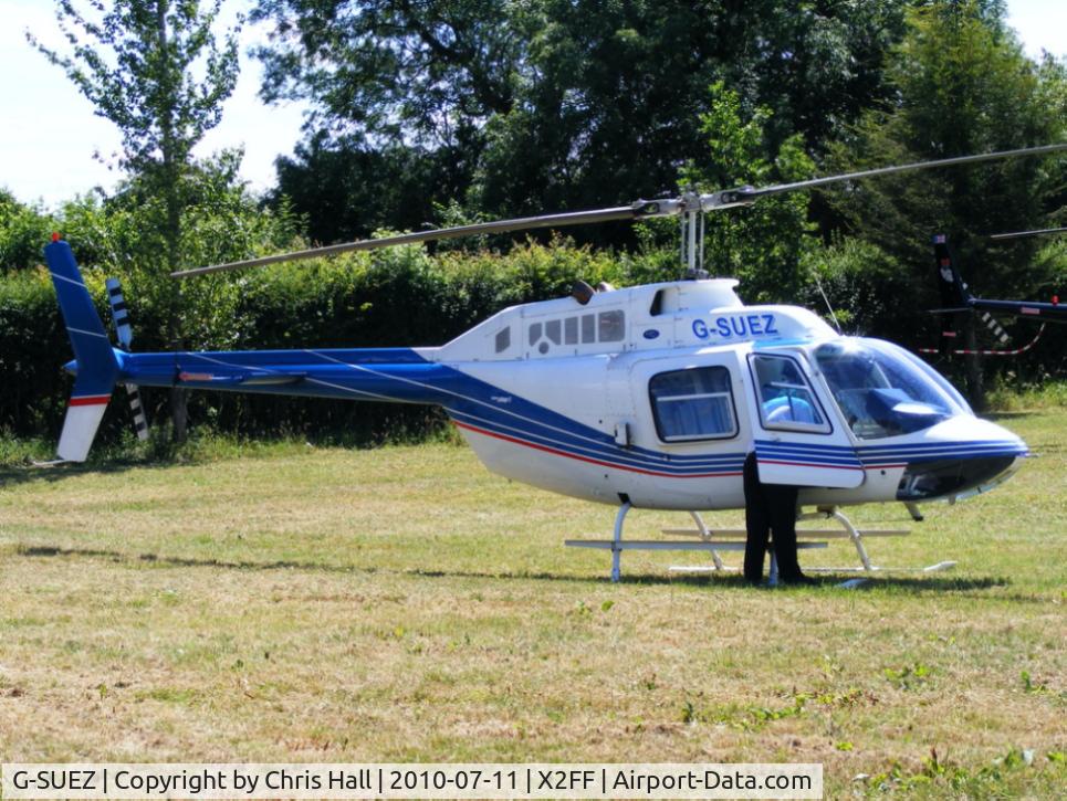 G-SUEZ, 1970 Agusta AB-206B JetRanger II C/N 8319, Bell 206 Jet Ranger being used for ferrying race fans to Silverstone for the British Grand Prix from this temporary heliport a few miles east of Bicester