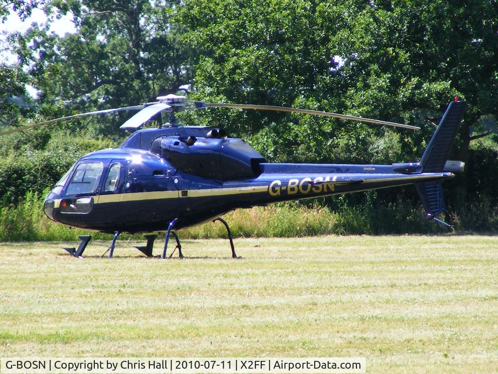 G-BOSN, 1982 Aerospatiale AS-355F-1 Ecureuil 2 C/N 5266, Aerospatiale AS355F1 Ecureuil II being used for ferrying race fans to Silverstone for the British Grand Prix from this temporary heliport a few miles east of Bicester