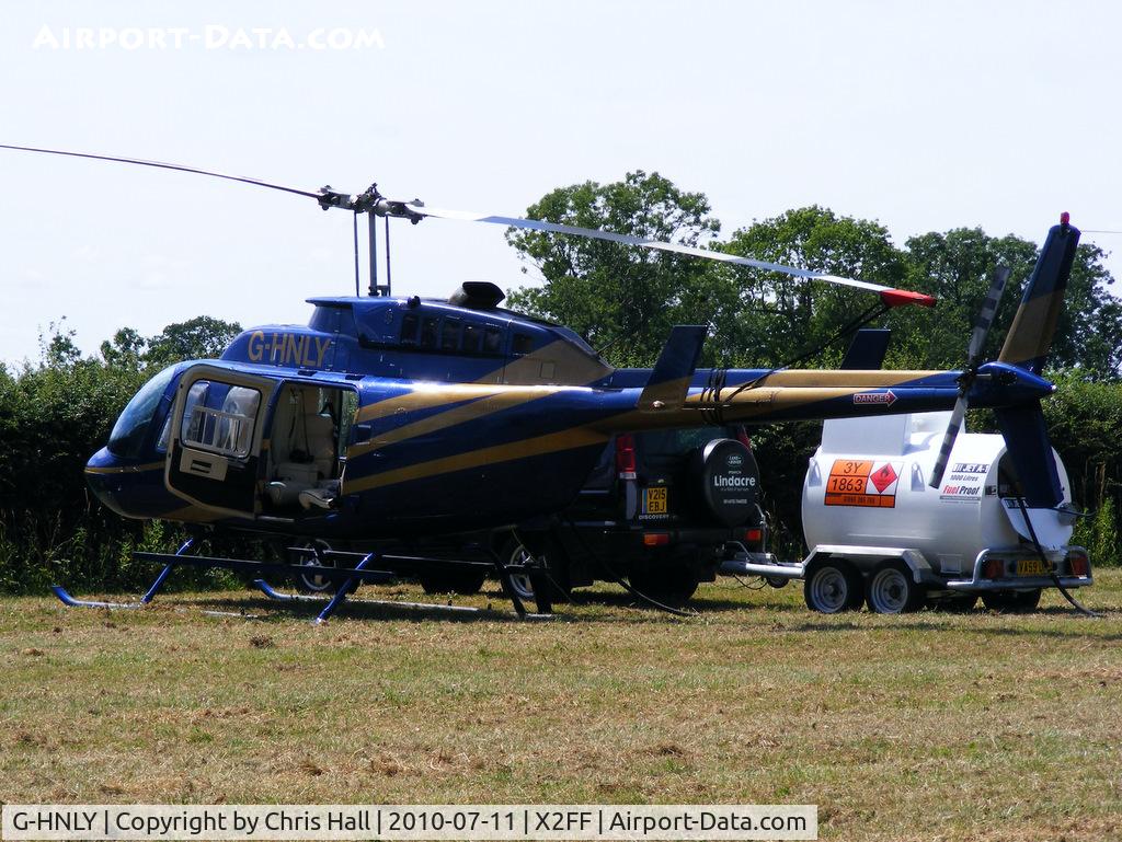 G-HNLY, 1982 Bell 206L-3 LongRanger III C/N 51048, Bell 206 Jet Ranger used for ferrying race fans to Silverstone for the British Grand Prix from this temporary heliport a few miles east of Bicester