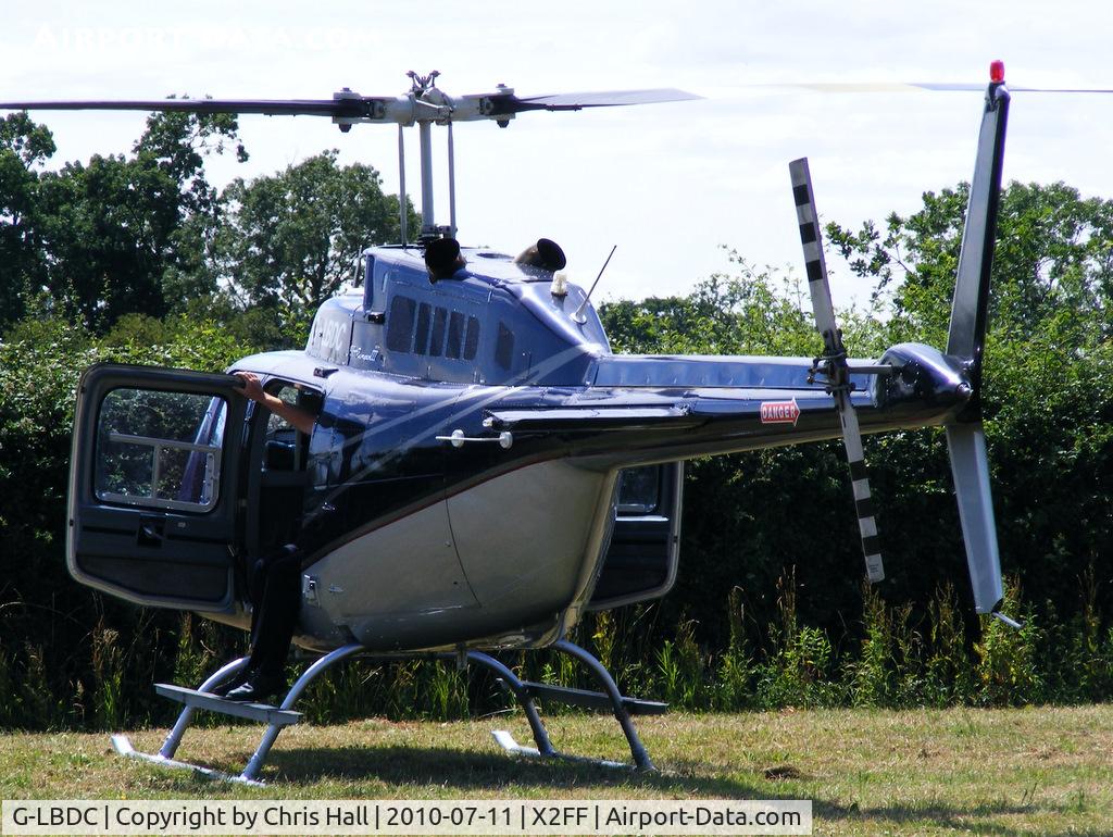 G-LBDC, 1984 Bell 206B JetRanger III C/N 3806, Bell 206 Jet Ranger used for ferrying race fans to Silverstone for the British Grand Prix from this temporary heliport a few miles east of Bicester