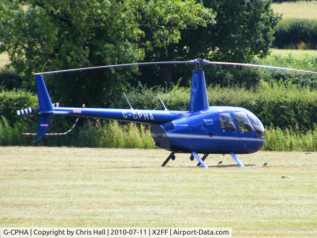 G-CPHA, 2008 Robinson R44 Raven II C/N 12641, Robinson R44 being used for ferrying race fans to Silverstone for the British Grand Prix from this temporary heliport a few miles east of Bicester