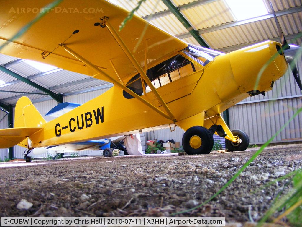 G-CUBW, 2005 Wag-Aero CUBy Acro Trainer C/N PFA 108-13581, shot from under the hangar door at Hinton in the Hedges