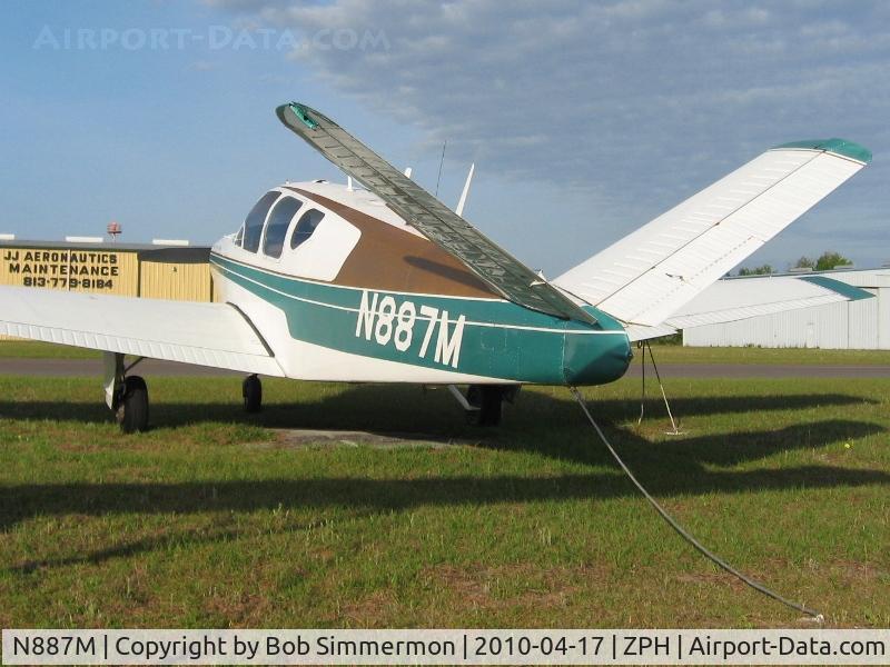 N887M, 1956 Beech G35 Bonanza C/N D-4747, Tied down at Zephyrhills, Florida during Sun N Fun week