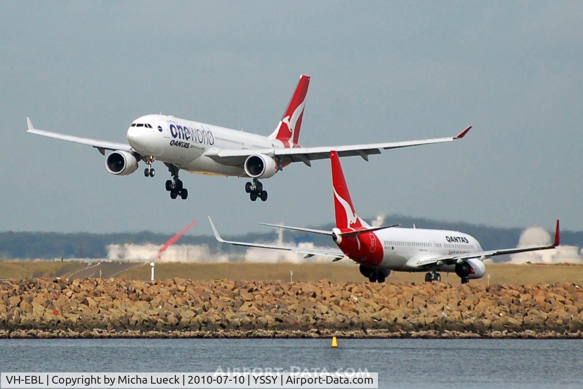 VH-EBL, 2008 Airbus A330-203 C/N 976, VH-EBL is about to touch down, while VH-VYL is taxiing for take-off