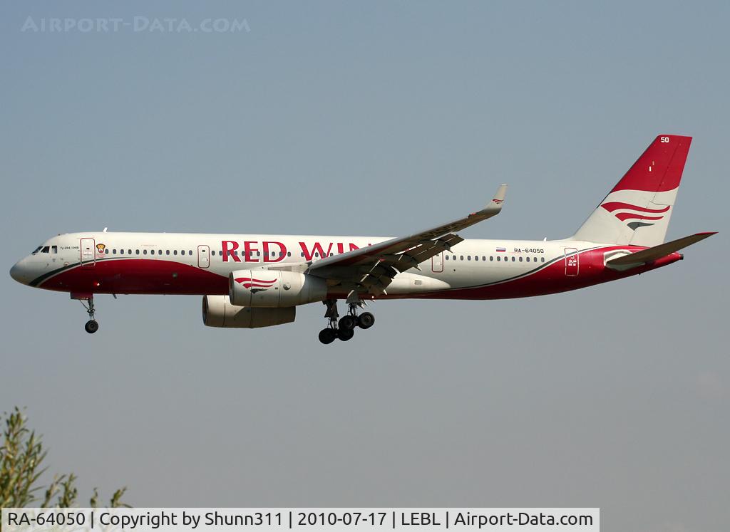 RA-64050, 2009 Tupolev Tu-204-100V C/N 145074-64050, Landing rwy 25R... Additional 'National Football Team' sticker near the first door...