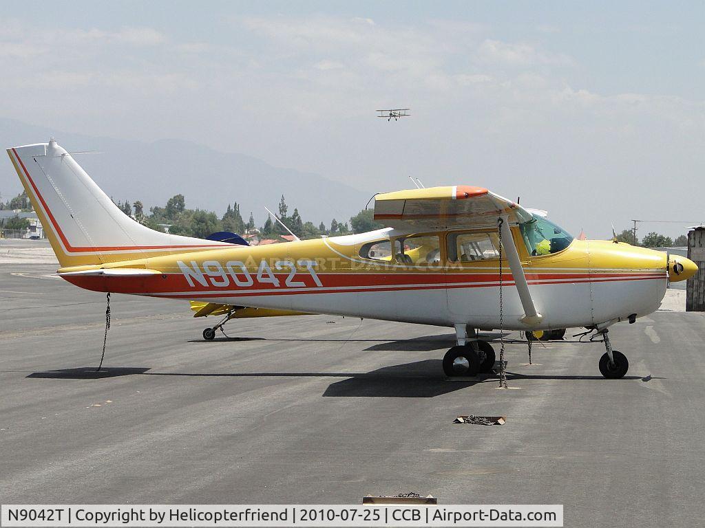 N9042T, 1960 Cessna 182C Skylane C/N 52942, Parked in transient parking while NC68800 is landing