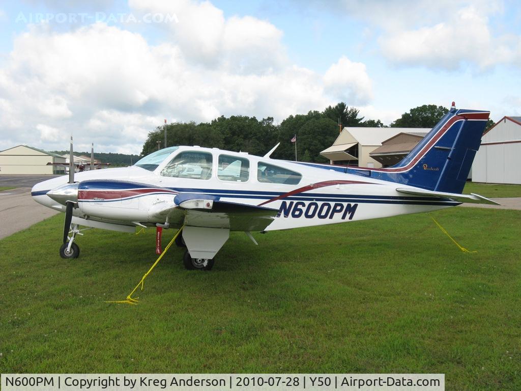 N600PM, 1977 Beech 95-B55 (T42A) Baron C/N TC-2082, Beech 55 Baron in the grass.