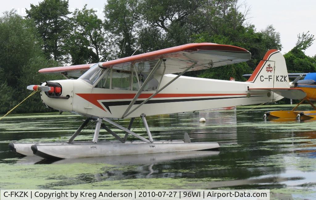 C-FKZK, 1947 Piper J3C-65 Cub Cub C/N 22983, Piper J3C-65 Cub moored at AirVenture 2010.