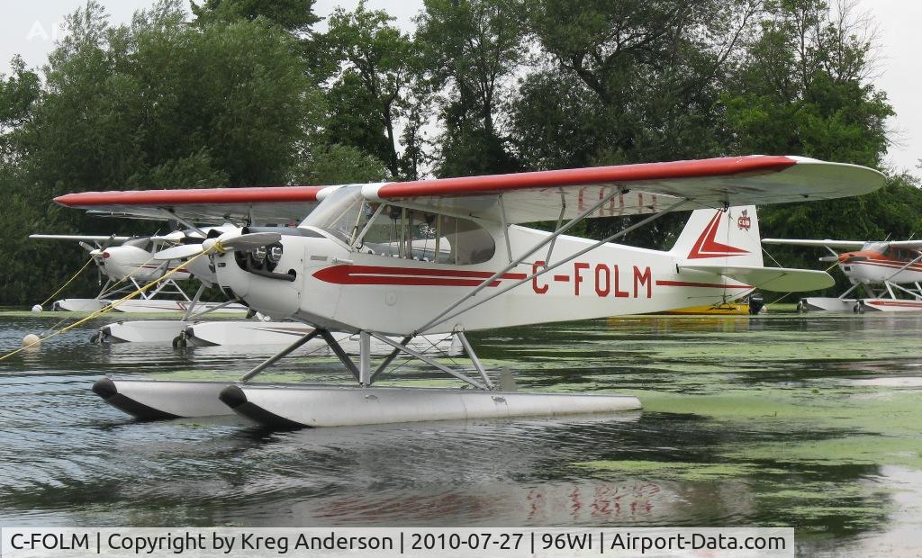 C-FOLM, 1947 Piper J3C-65 Cub Cub C/N 19084, Piper J3C-65 Cub moored at AirVenture 2010.