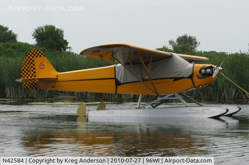 N42584, 1945 Piper J3C-65 Cub Cub C/N 14865, Piper J3C-65 Cub moored at AirVenture 2010.