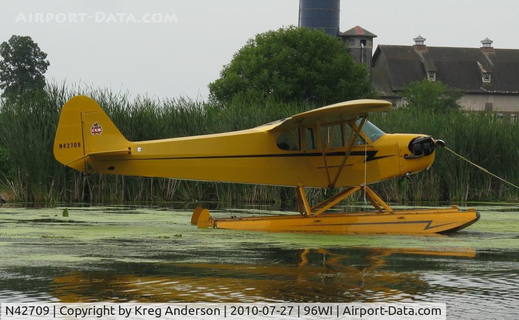 N42709, 1945 Piper J3C-65 Cub C/N 15007, Piper J3C-65 Cub moored at AirVenture 2010.