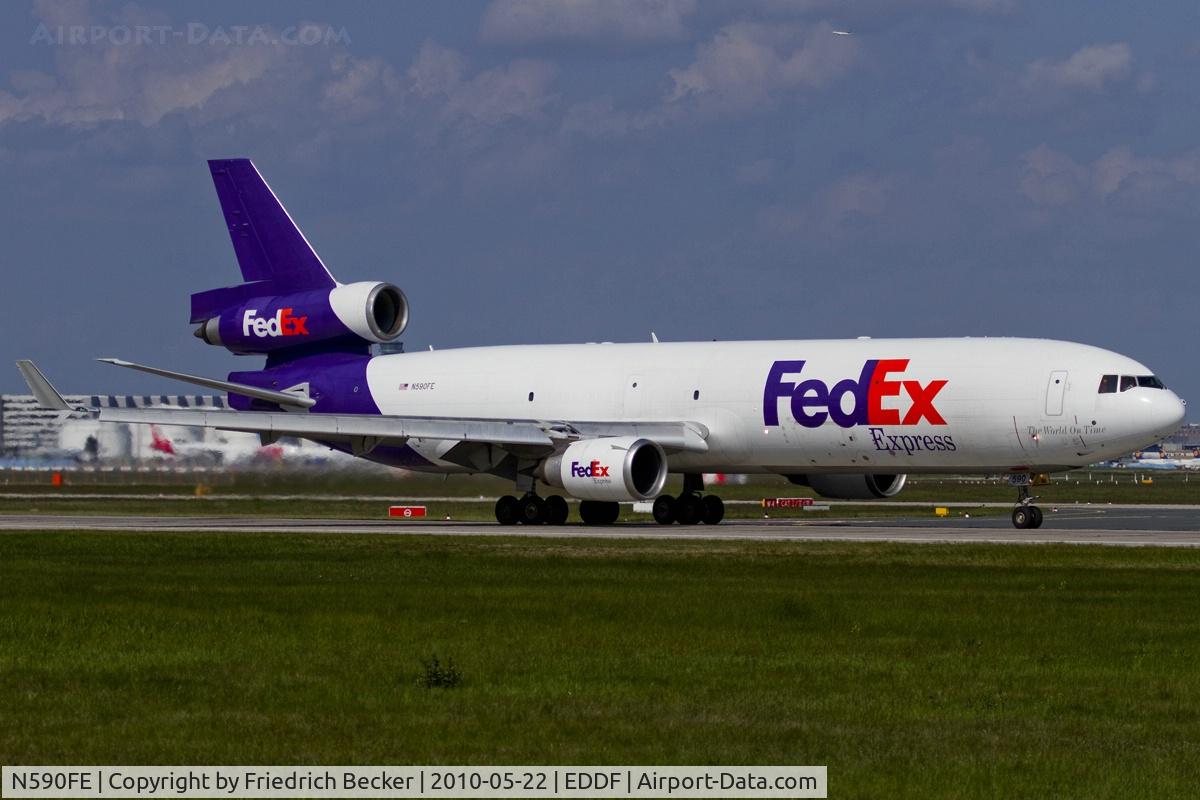 N590FE, 1991 McDonnell Douglas MD-11F C/N 48505, departing via RW18W