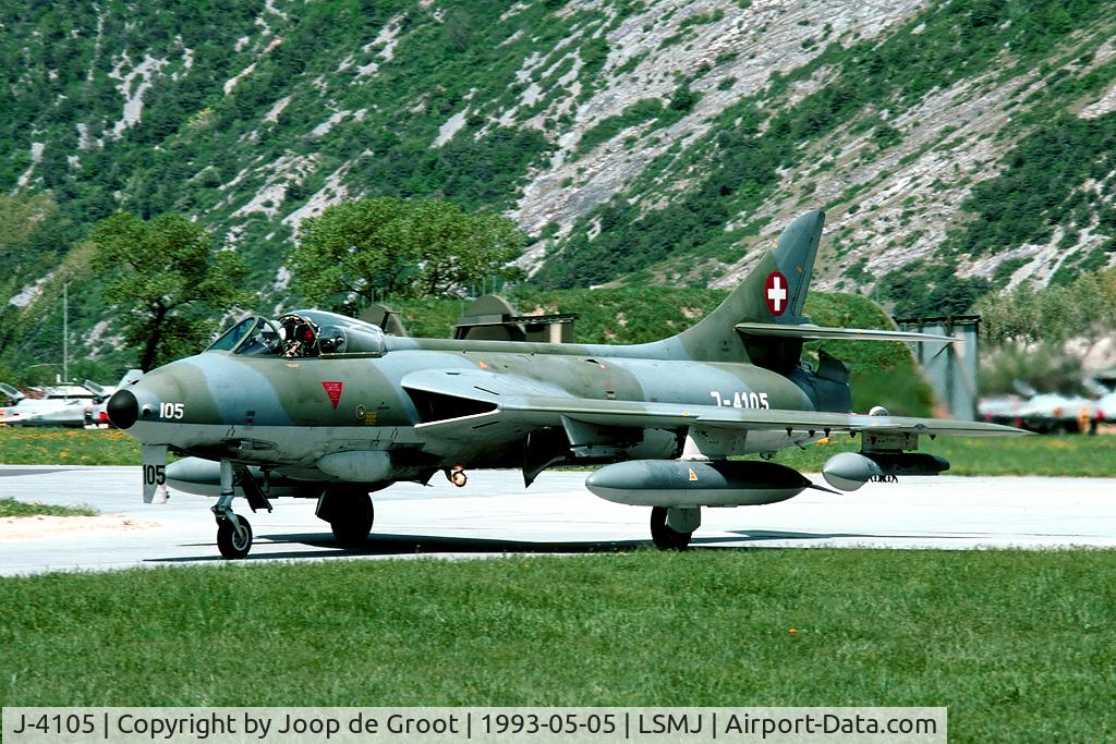 J-4105, 1956 Hawker Hunter F.58A C/N HABL-003074, This Hunter returns from one of the missions during WK93. Watch all those F-5's in the background. It is hardly imaginable how the Swiss AF housed over 25 aircraft in a cave..!