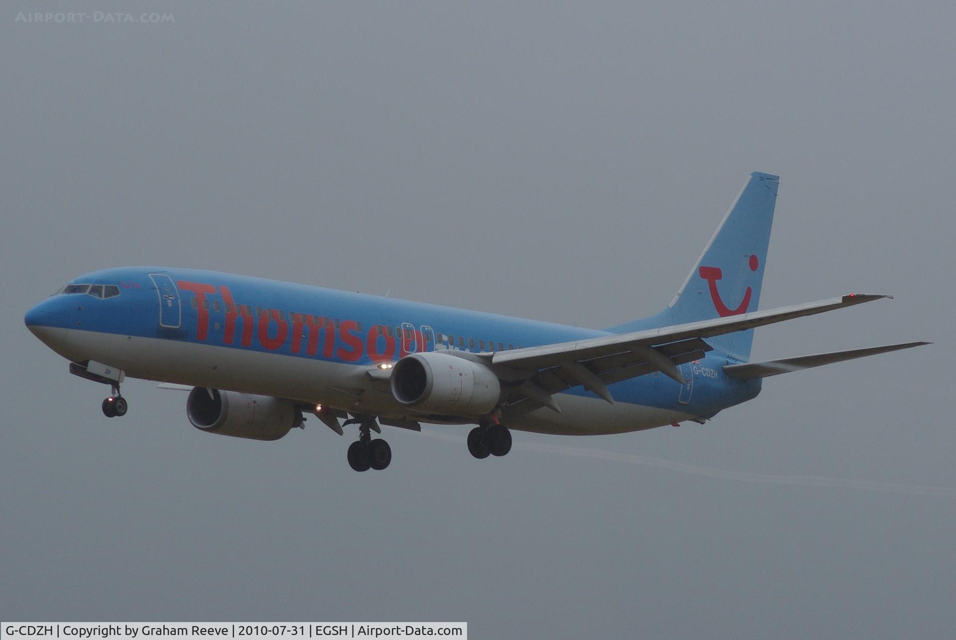 G-CDZH, 1999 Boeing 737-804 C/N 28227, Arriving in heavy rain.
