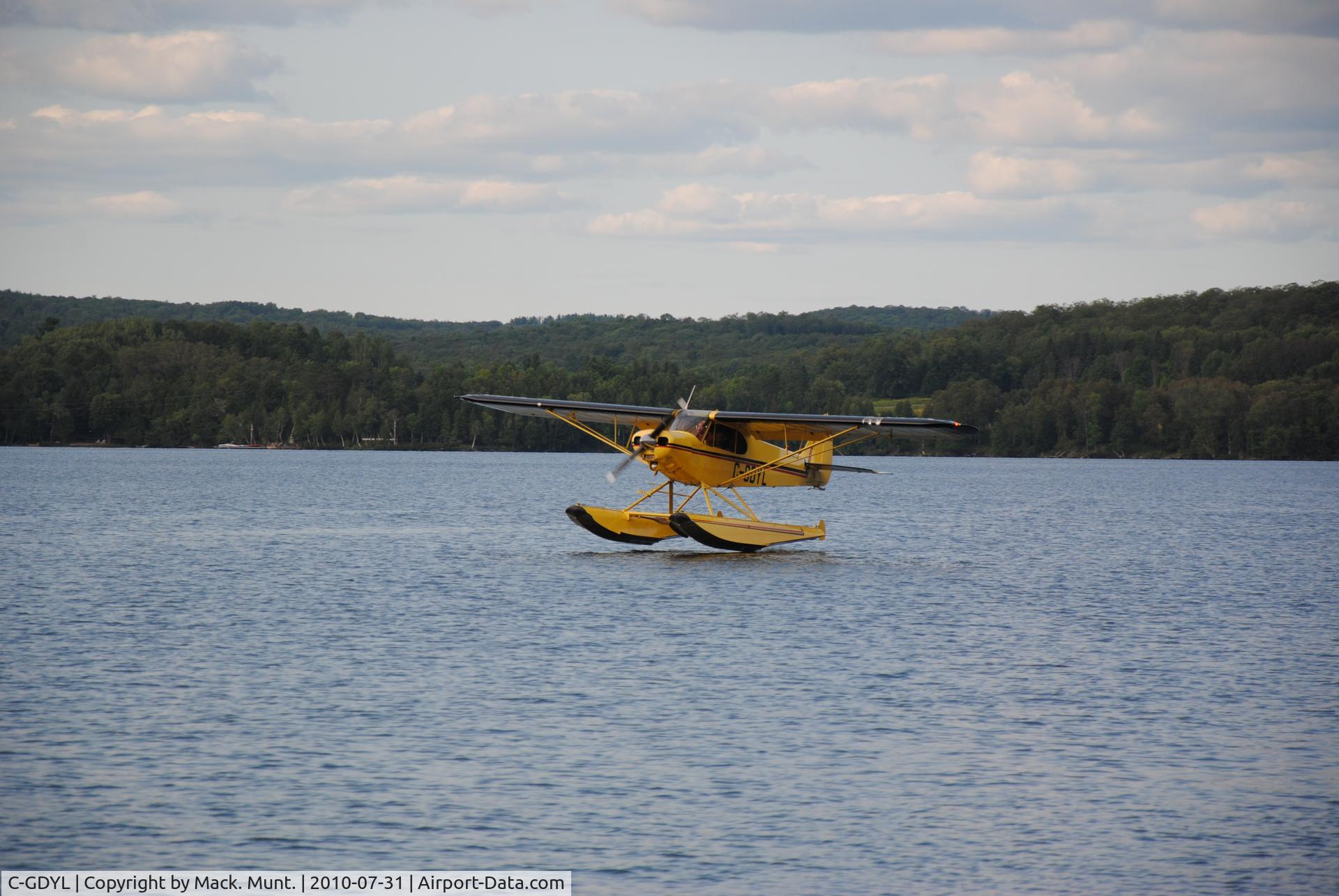 C-GDYL, 1976 Piper PA-18-150 Super Cub C/N 18-7609083, C-GDYL landing on a lake in Huntsville.