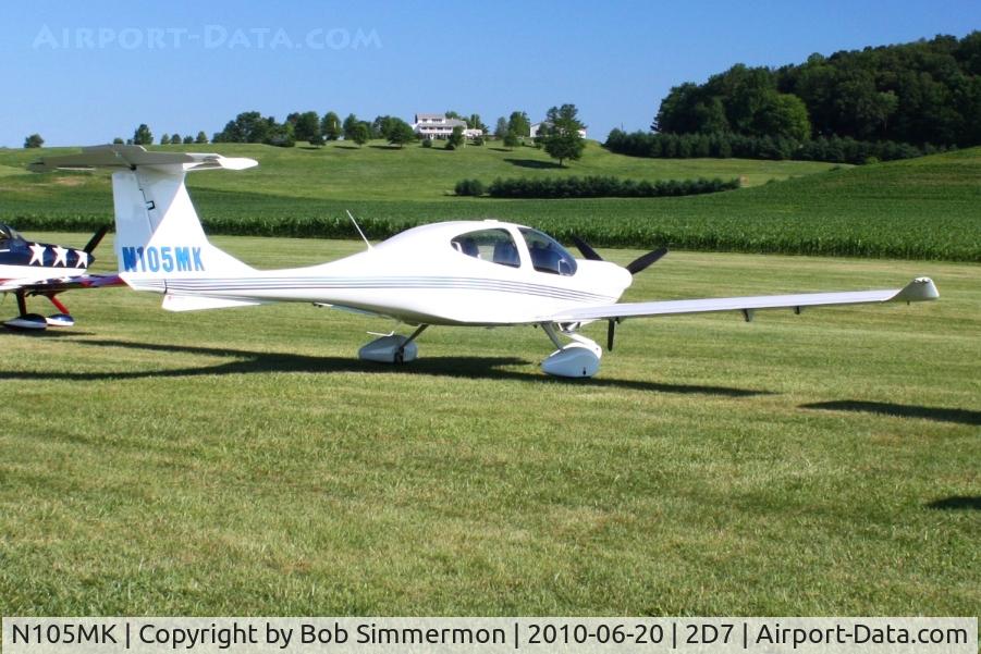 N105MK, 2002 Diamond DA-40 Diamond Star C/N 40.244, Parked in the grass at the Father's Day breakfast fly-in, Beach City, Ohio.