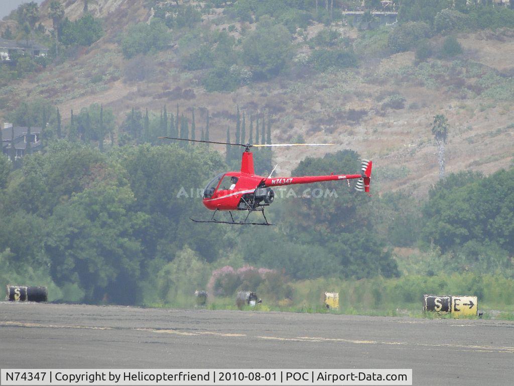 N74347, 2005 Robinson R22 Beta C/N 3759, Air taxiing from runway 26R crossing runway 26L and landing at the west helipad