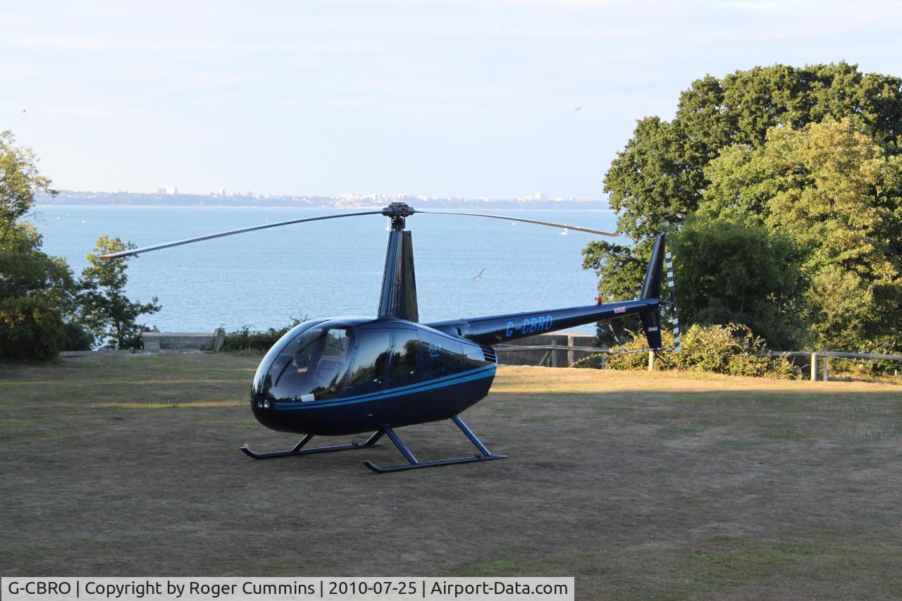 G-CBRO, 2002 Robinson R44 Raven C/N 1221, Manor House Hotel grounds ,Studland Peninsular