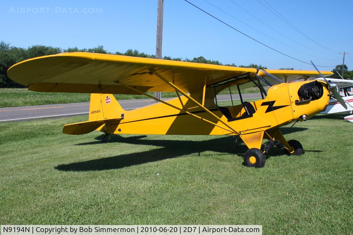 N9194N, Piper J3C-65 Cub C/N 22321, Parked in the grass at Beach City, Ohio during the Father's Day fly-in.