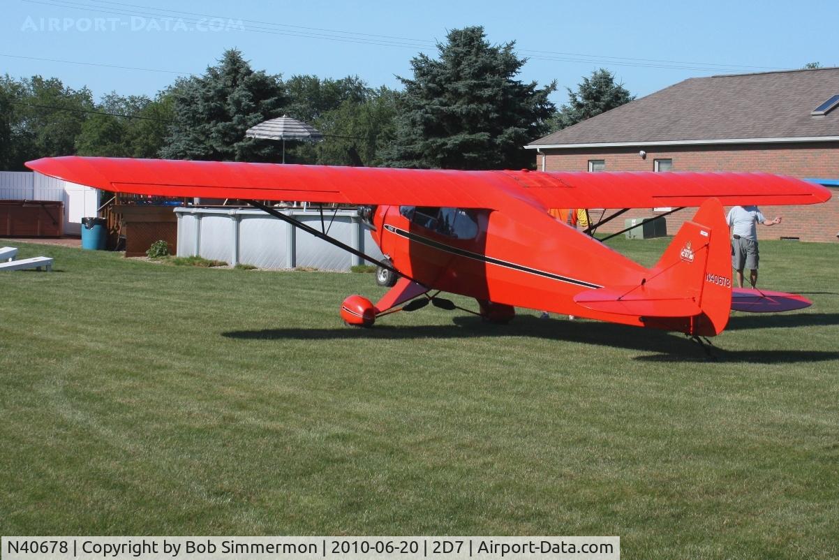N40678, 1941 Piper J5A Cub Cruiser C/N 5-1116, Parked in the grass at Beach City, Ohio during the Father's Day fly-in.