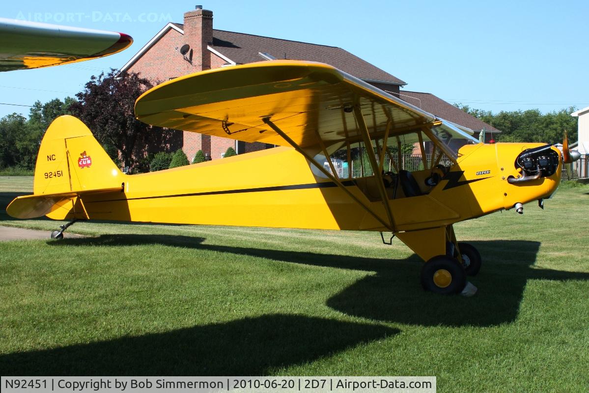 N92451, 1946 Piper J3C-65 Cub Cub C/N 16920, Parked in the grass at Beach City, Ohio during the Father's Day fly-in.