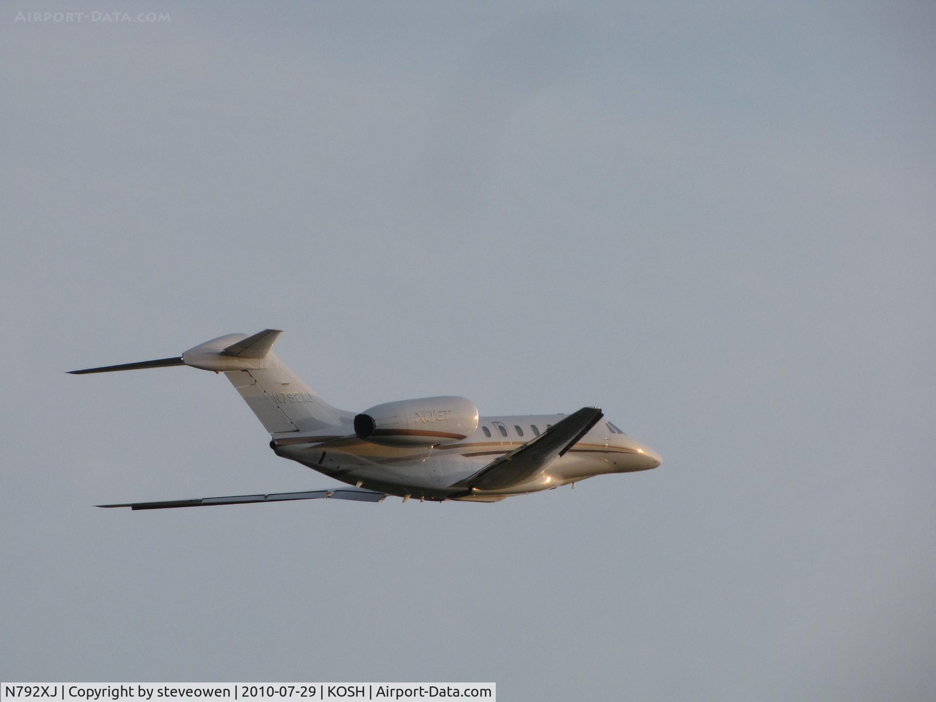 N792XJ, 2008 Cessna 750 Citation X Citation X C/N 750-0292, Leaving Oshkosh into setting sun