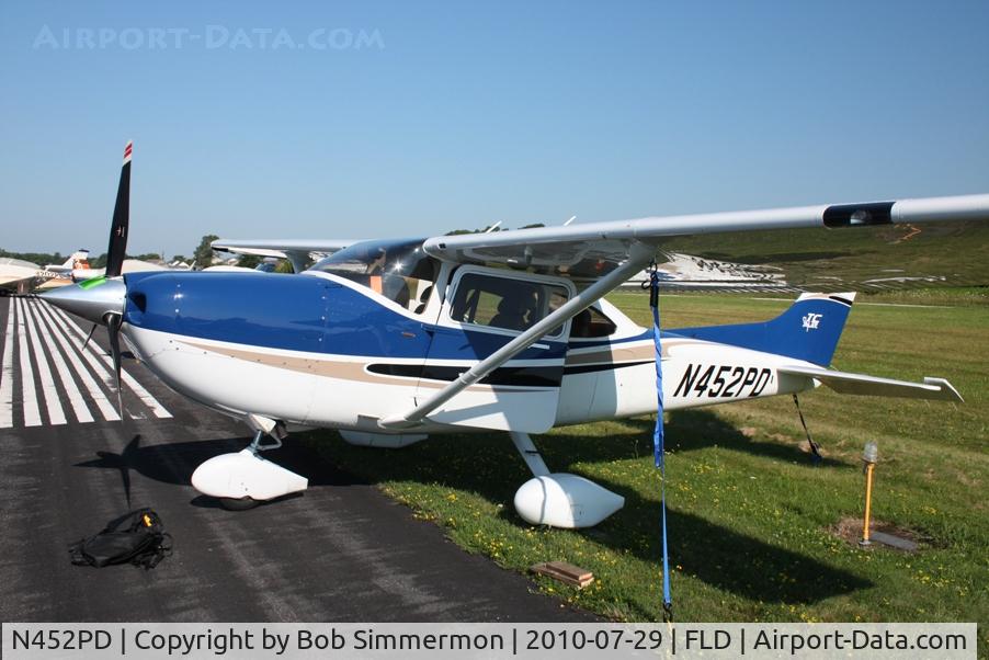 N452PD, 2004 Cessna T182T Turbo Skylane C/N T18208282, Tied down along RWY 9-27 during Oshkosh 2010.