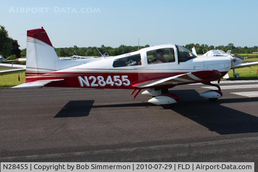 N28455, 1977 Grumman American AA-5B Tiger C/N AA5B0619, Taxiing through a crowd of planes parked along RWY 9-27 to depart Fond Du Lac, Wisconsin during Oshkosh 2010.