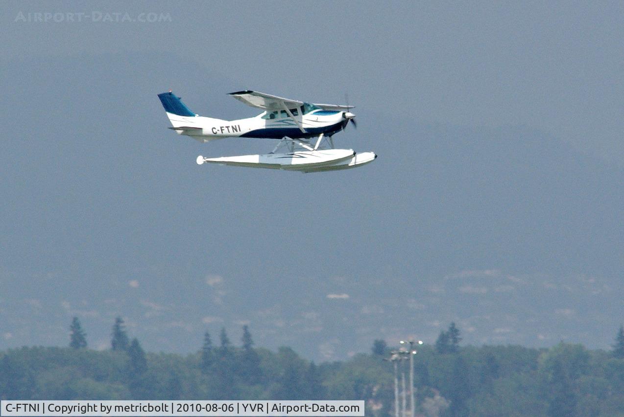 C-FTNI, 1964 Cessna 182G Skylane C/N 18255208, landing on a hot hazy day