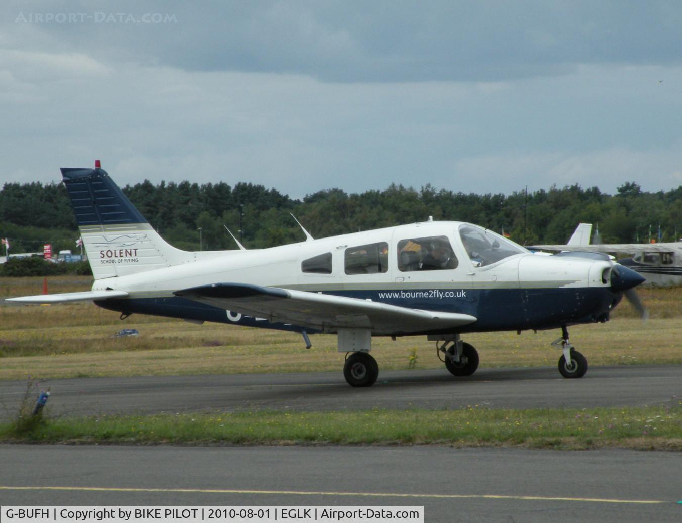 G-BUFH, 1984 Piper PA-28-161 Warrior II C/N 28-8416076, VISITING CHEROKEE TAXYING PAST THE CAFE