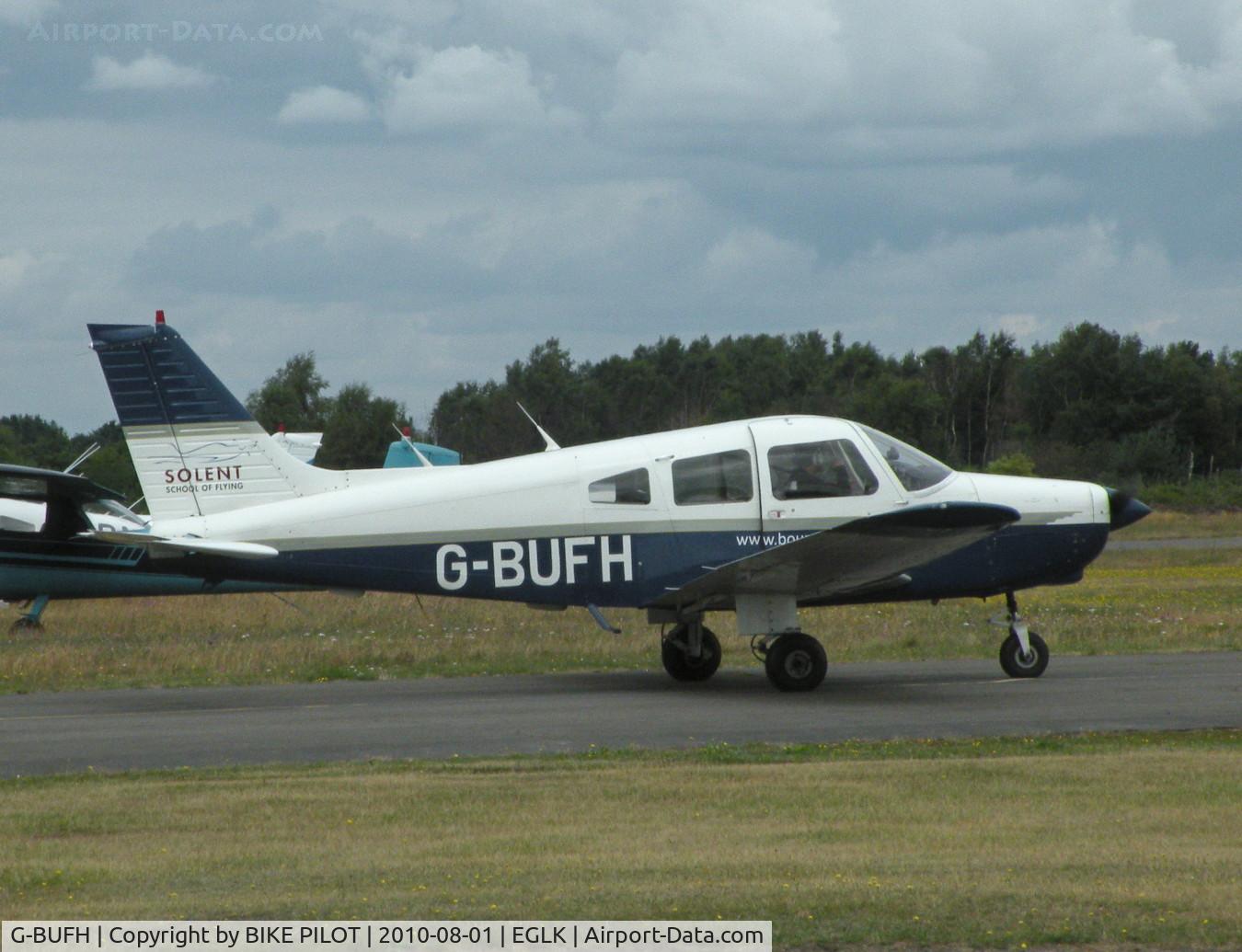 G-BUFH, 1984 Piper PA-28-161 Warrior II C/N 28-8416076, VISITING CHEROKEE TAXYING PAST THE CAFE