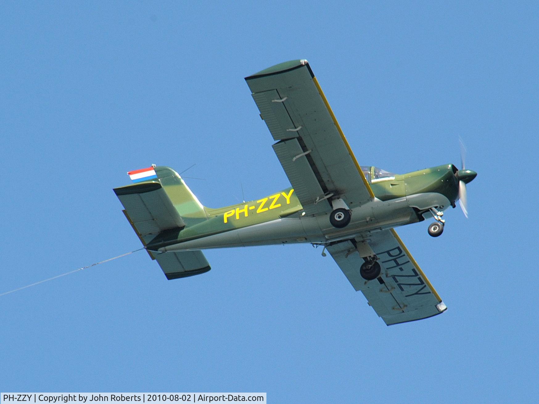 PH-ZZY, Socata MS-893E Rallye Commodore 180GT C/N 12704, Taken by the coast near Hayle. The plane was pulling a banner for Flambards Theme Park Helston.