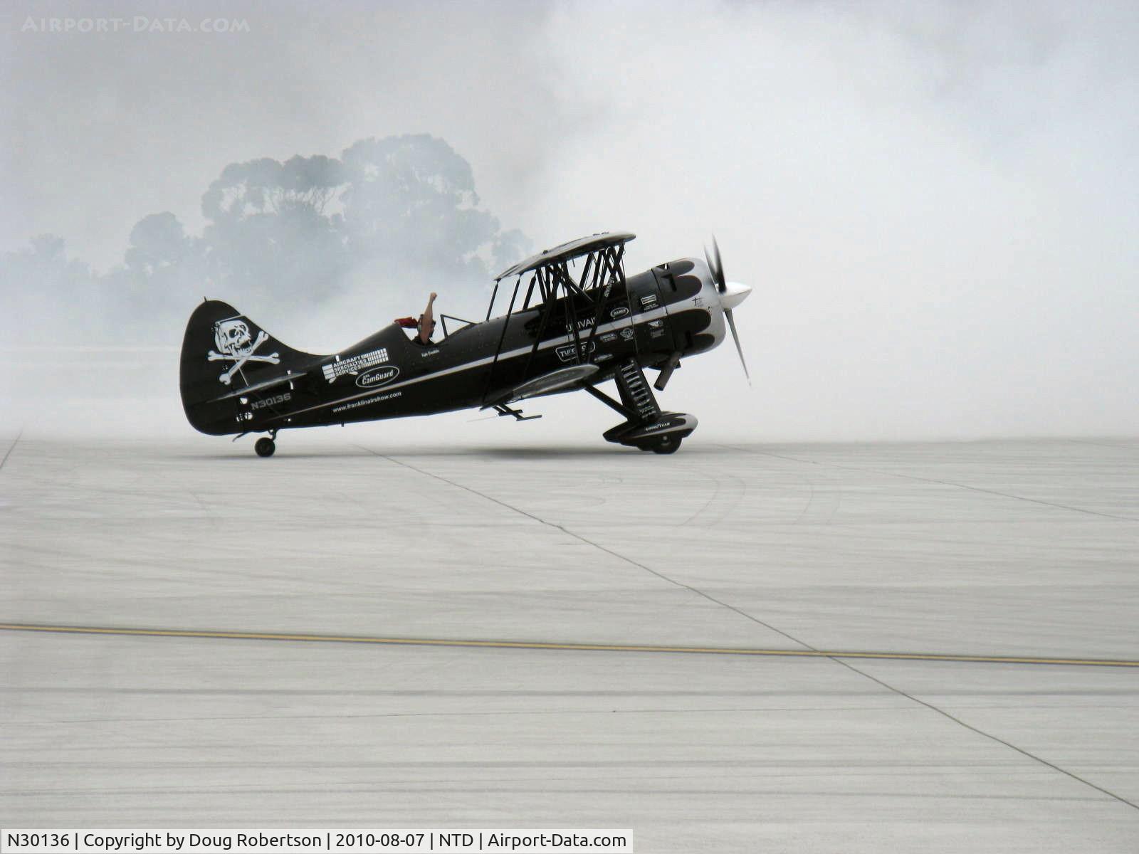 N30136, 1980 Waco UPF-7 C/N 5533, 1980 Waco UPF-7, P&W R-985 Wasp Jr. 450 Ho upgrade, Experimental Exhibition class, taxi at end of airshow aerobatics act. Low ceiling and fog but the Waco was pressed to its limit.